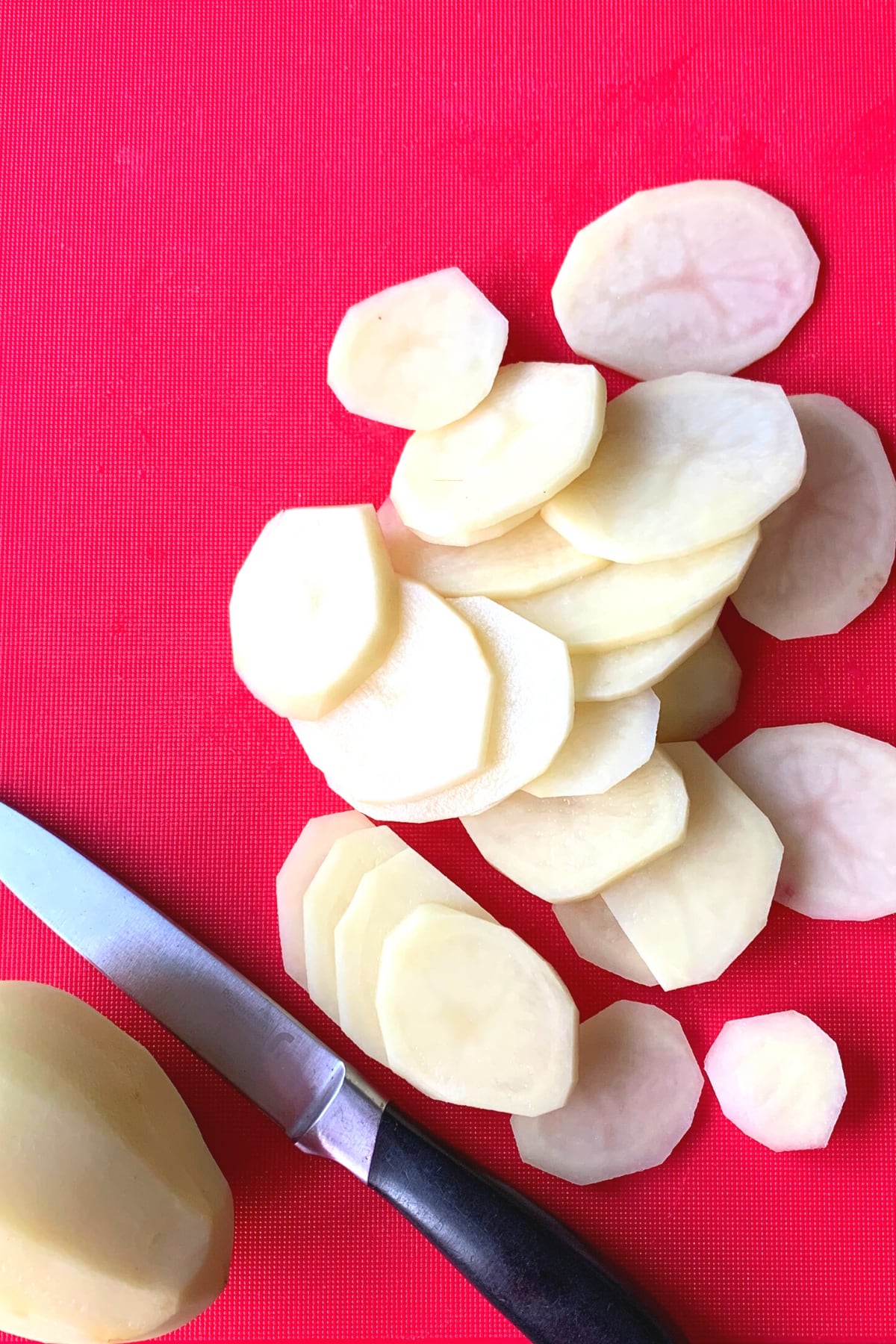 Cheesy Oven-Baked Garlic Potatoes, sliced potatoes